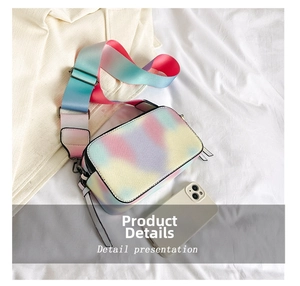 Detail view of rainbow gradient mini bag with wide strap compared to a smartphone
