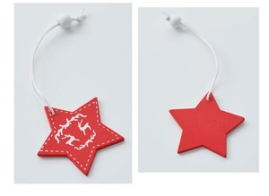 Detail of red wooden star ornament featuring white reindeer motif and hanging bead