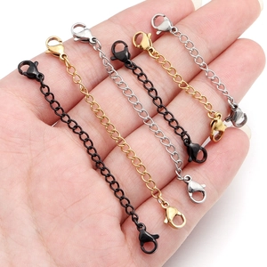 Detail of stainless steel curb chains in black, gold, and silver with lobster clasps