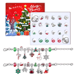 Christmas Advent Calendar jewelry set with 24 festive charms and two metal DIY bracelets