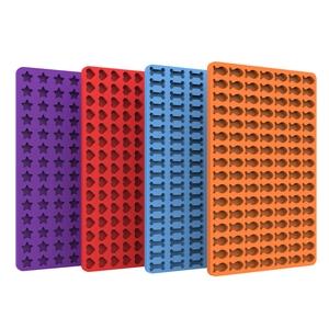 Colorful silicone candy molds in star, heart, bone and fish shapes for chocolate or baking
