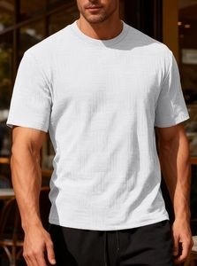 Close-up of white slim fit men's T-shirt featuring a unique 3D square textured waffle fabric