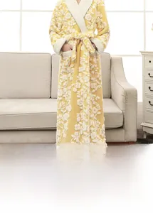 Detail showing the thick flannel fabric and floral pattern of this long warm bathrobe