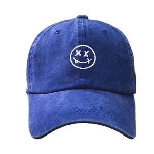 Navy blue washed cotton baseball cap with white embroidered smiley face and XX eyes