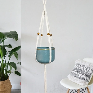 Bohemian cotton rope plant hanger with turquoise ceramic pot and wooden bead accents