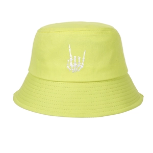 Detail showing white skeletal hand embroidery on neon green cotton bucket hat