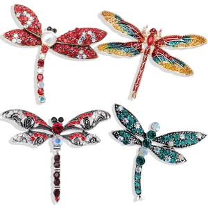 Set of four vintage dragonfly brooches with colorful rhinestones and enamel details