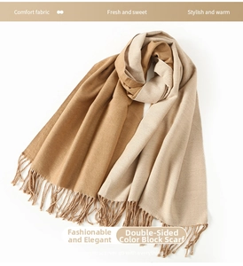 Close-up of dual-color knit scarf featuring elegant long tassels and soft texture