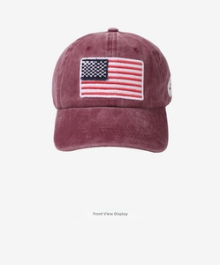 Close-up of vintage burgundy washed cotton baseball cap with American flag embroidery