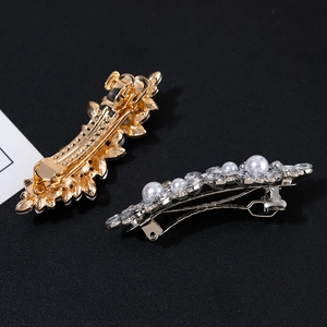 Pair of sparkling rhinestone and pearl leaf duckbill hair clips in gold and silver