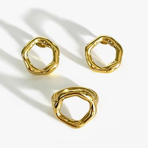 Golden irregular geometric hoop earrings and ring set with minimalist liquid metal design