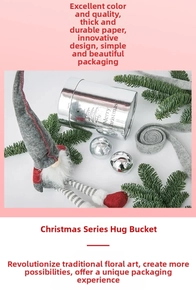 Close-up of silver mirror Christmas flower box with Merry Christmas text and tree sketch