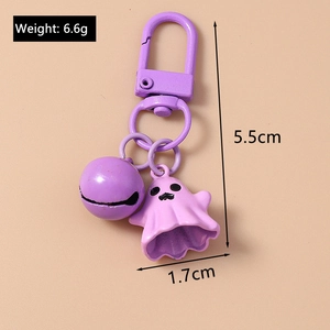 Detail of purple ghost keychain with bell showing dimensions of 5.5cm and 6.6g weight