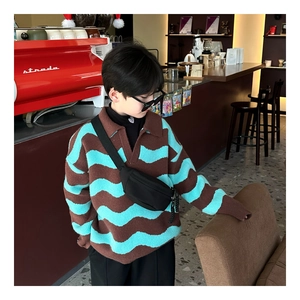 Detail showing high-quality knitted fabric with wave pattern on children trendy sweater