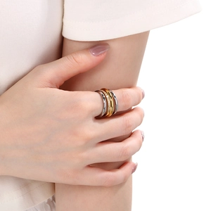Detail of multi-layer interlocking ring with sparkling crystals on a model's hand