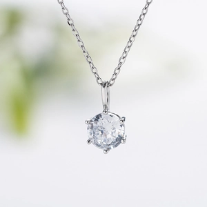 Elegant six-prong silver necklace with a brilliant round-cut sparkling cubic zirconia