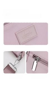 Detail showing the purple Oxford fabric texture with XINGTU logo and metal hardware components