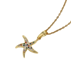 Gold starfish pendant necklace with colorful zircons on cross chain over white backdrop