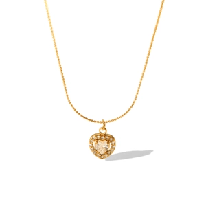 Detail of 18K gold stainless steel necklace featuring a micro-paved heart pendant