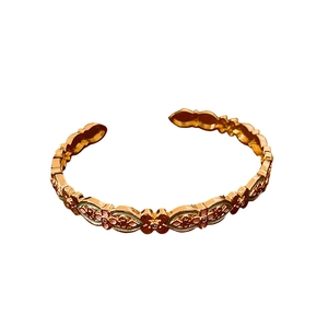 Vintage 18k gold plated bangle with pink and green enamel flower patterns on white base
