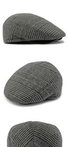 Detailed views of grey plaid flat cap showing wool texture and classic check pattern