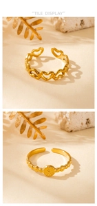 Detail of adjustable gold-tone rings with heart cut-outs and round textured patterns