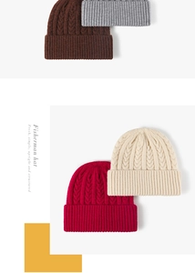 Detail of thick cable knit beanies in dark brown, grey, red, and cream white colors
