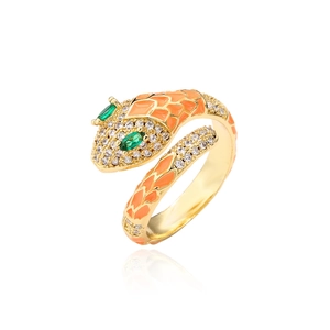 Close-up of gold snake ring with orange enamel scales and green zircon eyes