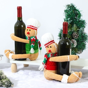 Christmas gingerbread man wine bottle cover with red and green knitted chef hat decor