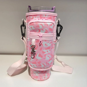 Pink leopard print 40oz tumbler carrier with adjustable strap and zipper pocket