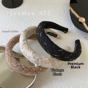 Detail of three handmade tweed headbands in milk coffee, linen, and black colors