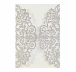 Detailed laser-cut silver glitter invitation cover with elegant floral vine patterns