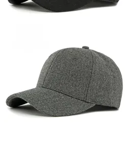 Close-up of a dark grey wool baseball cap showing premium warm fabric texture