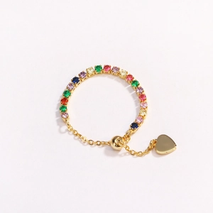 Adjustable gold chain ring with colorful rainbow crystals and a heart-shaped metal pendant