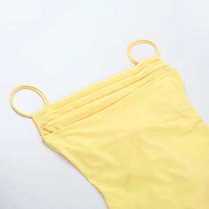 Detail shot of bright yellow camisole top showing the pleated neckline craftsmanship