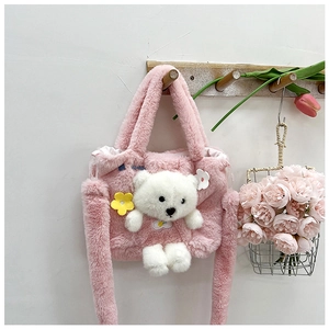 Detail of pink plush girls handbag with a 3D teddy bear and colorful flower accents