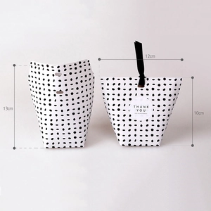 Minimalist white and polka dot gift boxes with black ribbon and Thank You stickers