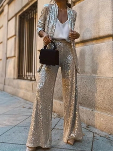 Detailed view of champagne gold sequin blazer and high-waist trousers suit for women