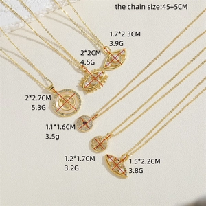Gold evil eye and virgin mary pendant necklaces with zircon on textured stone background