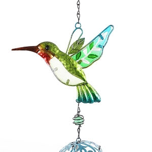 Macro detail of hand-painted hummingbird wind chime with metal tubes and colored glass