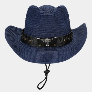 Detail of navy straw cowboy hat with leather band and metallic bull head ornament