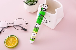Close-up of the cute panda topper on the green 10-color multi-function ballpoint pen