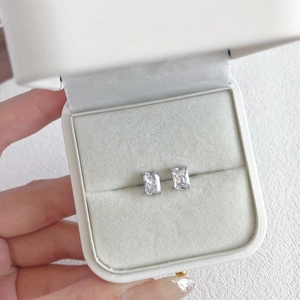 Close-up of square-cut S925 sterling silver stud earrings with sparkling white zircons