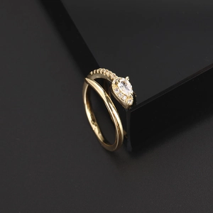 Detail of bohemian gold snake ring featuring teardrop cubic zirconia and micro-pave setting