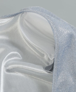Detailed view of silver-blue metallic knit fabric with smooth white inner lining and stitching