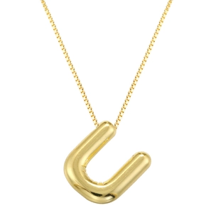 Macro shot of 3D puffy balloon letter U pendant on a gold box chain necklace