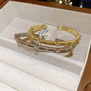 Retro brushed gold and silver open bangles featuring zircon inlays in a royal court style