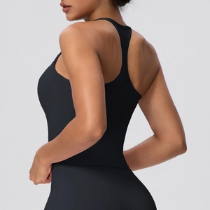 Close-up of black racerback sports top showing seamless stitching and stretch fabric