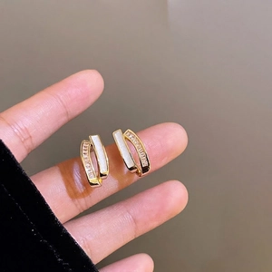 Elegant gold double-row earrings with sparkling cubic zirconia and white enamel inlay