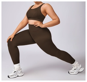 Detail of dark brown high-waisted yoga leggings and sports bra with high elasticity